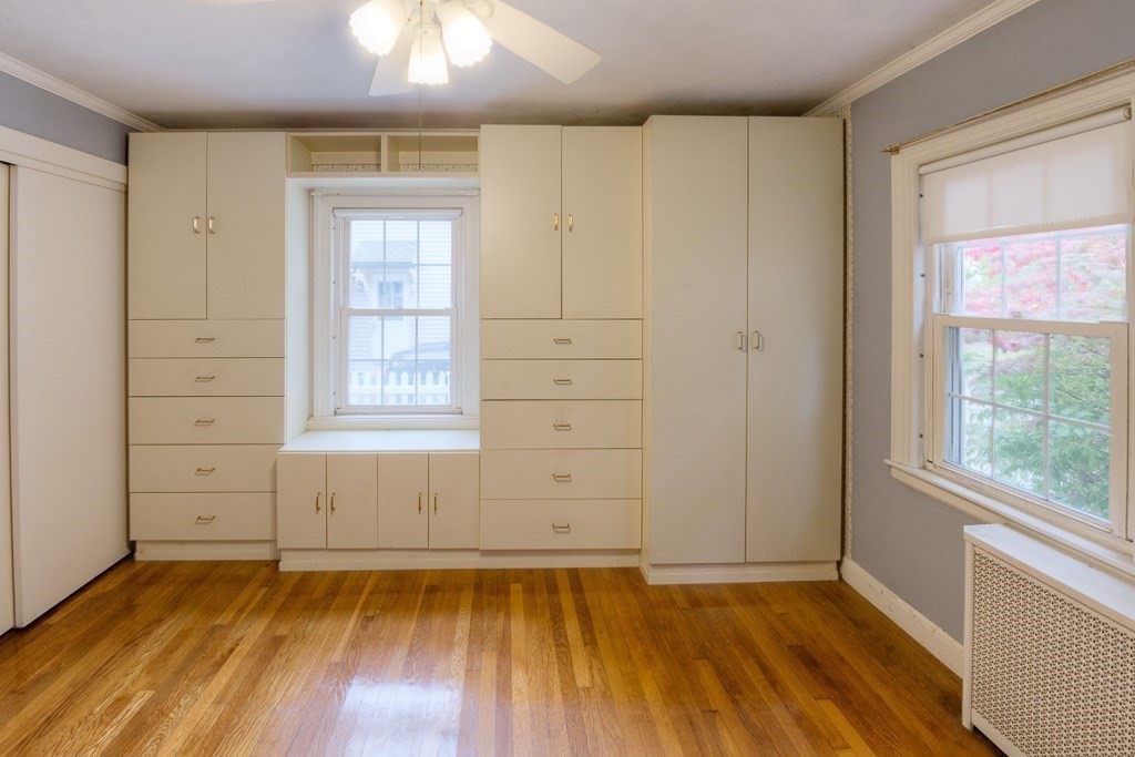 13 Westbrook Road Worcester, MA 01602 - Photo 29 of 41 an empty room with wooden floor cabinet and windows