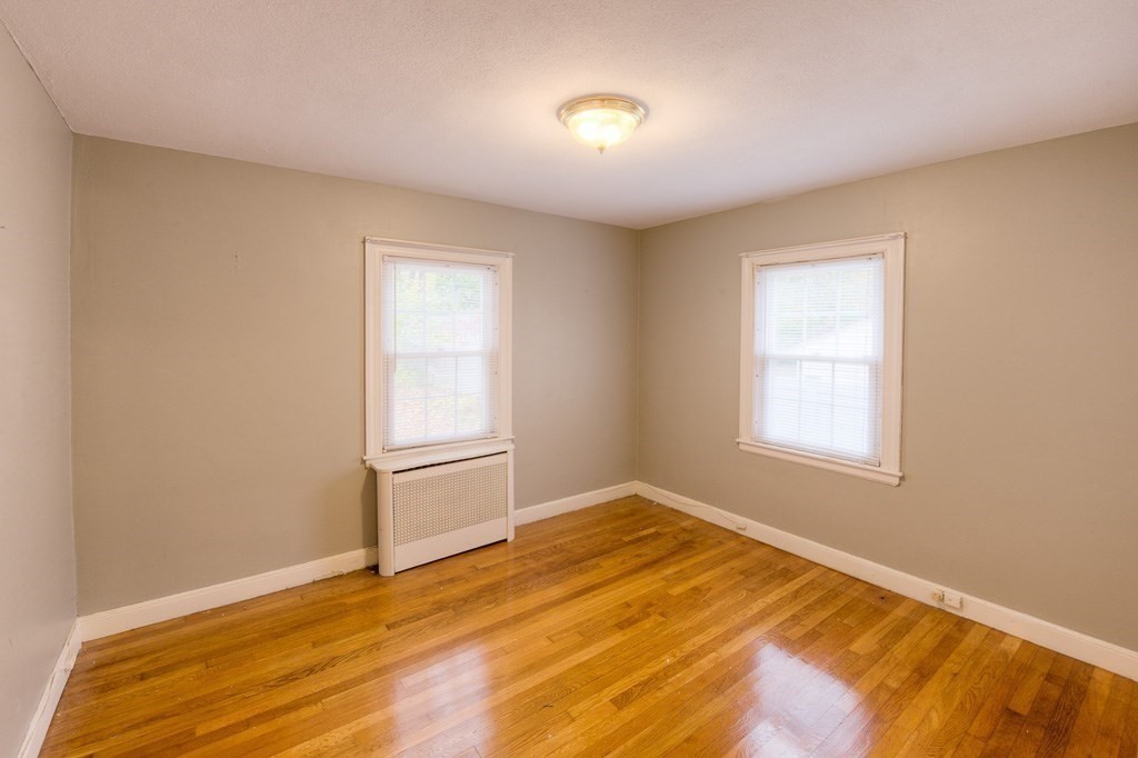 13 Westbrook Road Worcester, MA 01602 - Photo 32 of 41 a view of an empty room with wooden floor and a window
