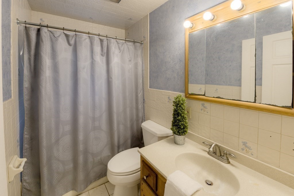 13 Westbrook Road Worcester, MA 01602 - Photo 33 of 41 a bathroom with a sink and a mirror