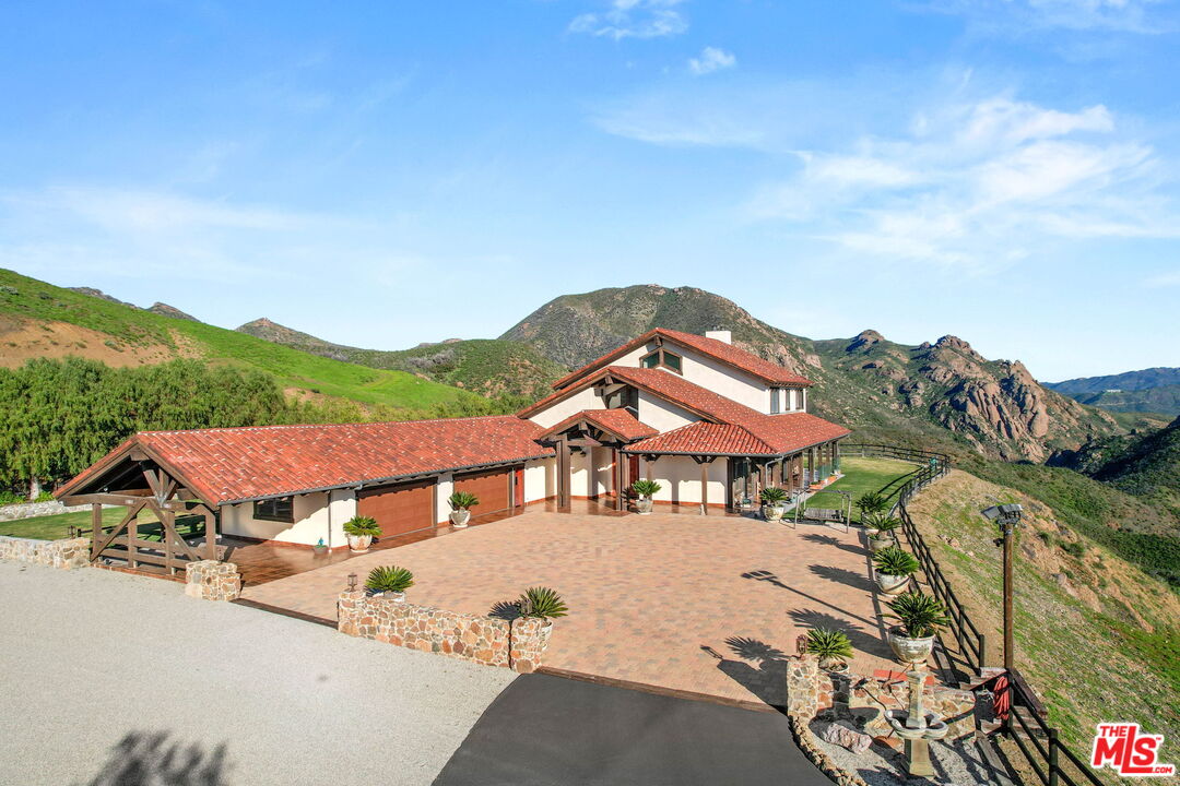 12486 Yerba Buena Road Malibu, CA 90265 - Photo 1 of 68 a view of a house with a yard