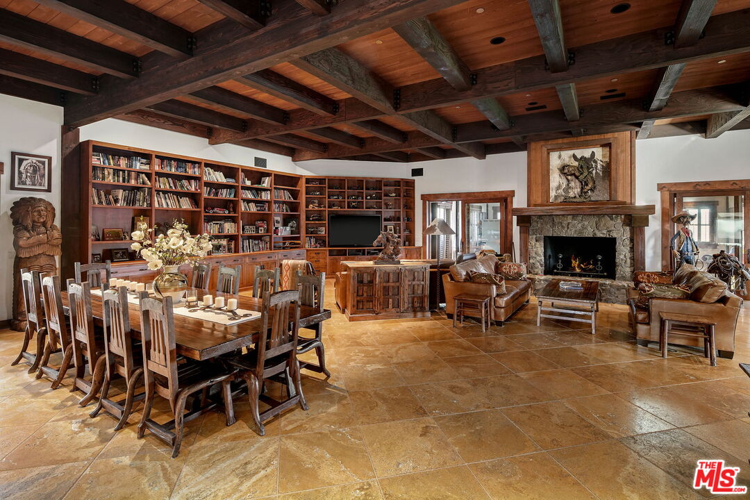 12486 Yerba Buena Road Malibu, CA 90265 - Photo 11 of 68 a view of a livingroom with furniture and a fireplace
