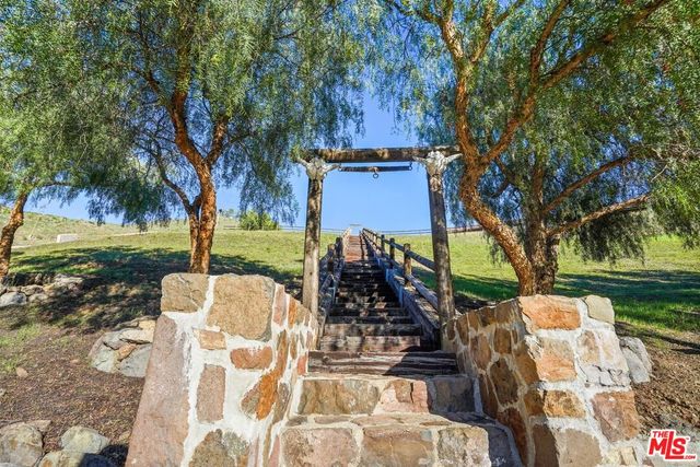 an aerial view of a house with a garden