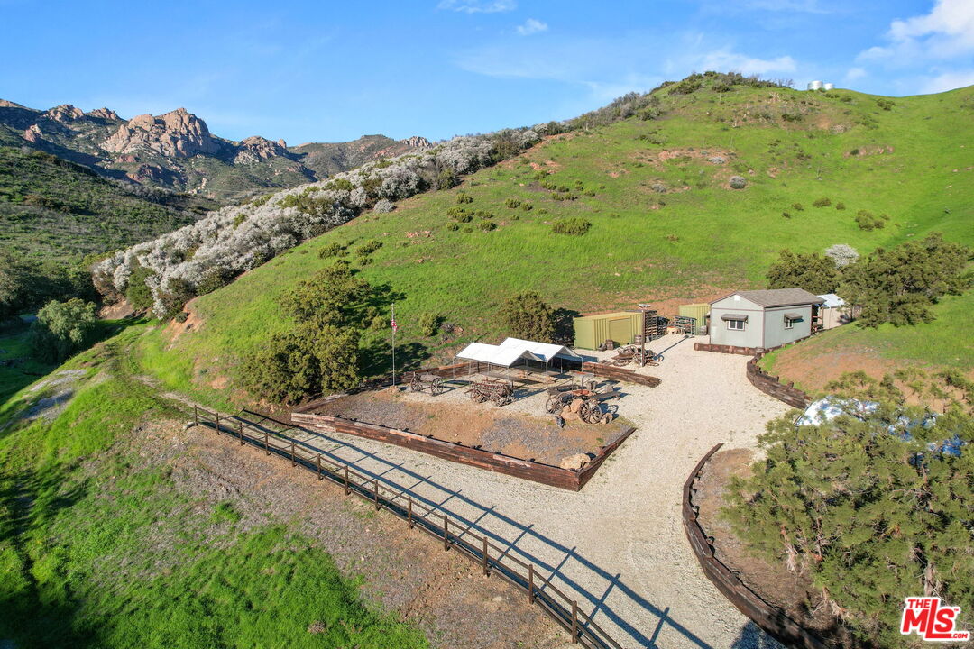 12486 Yerba Buena Road Malibu, CA 90265 - Photo 42 of 68 a view of a terrace with a table and chairs