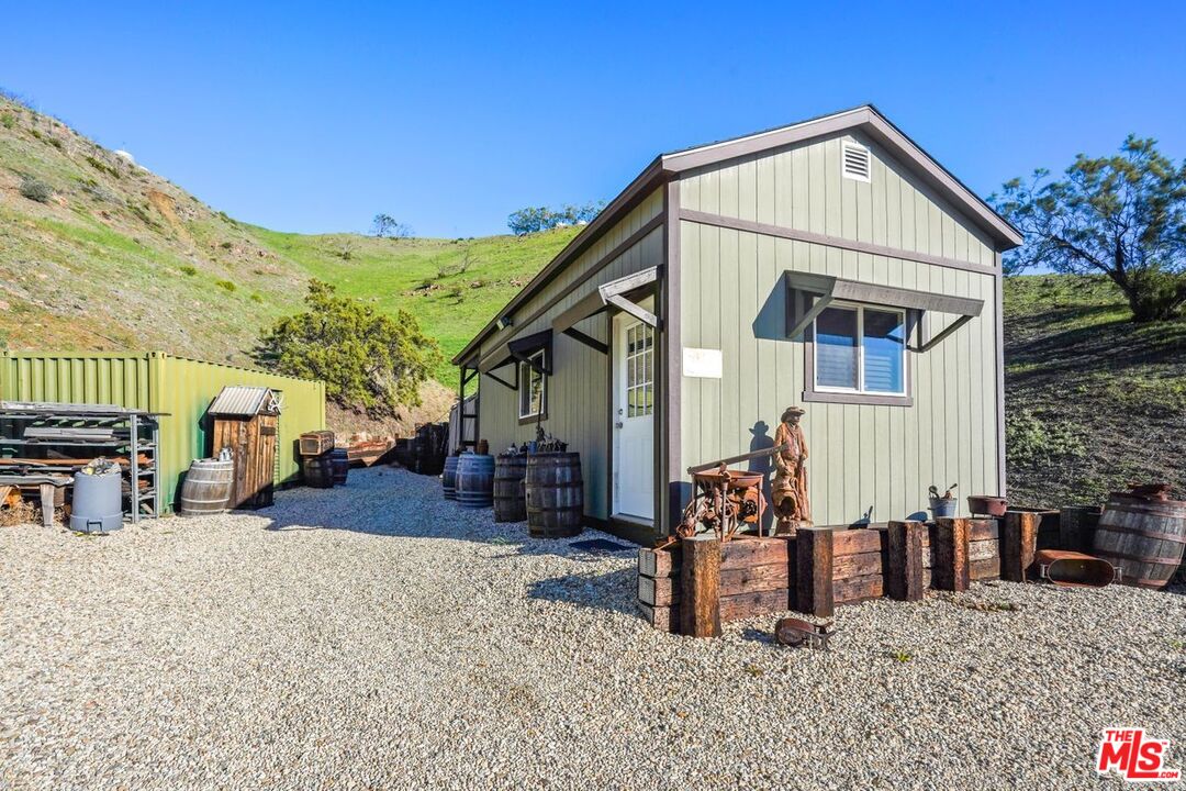 12486 Yerba Buena Road Malibu, CA 90265 - Photo 44 of 68 a front view of a house with patio