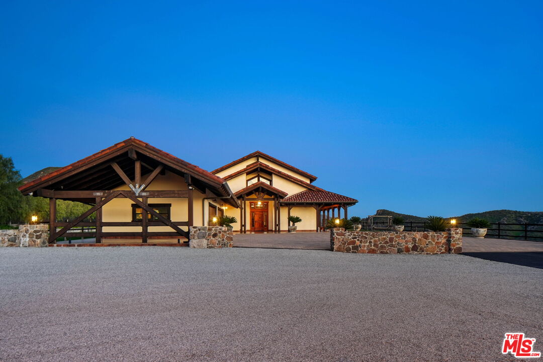 12486 Yerba Buena Road Malibu, CA 90265 - Photo 59 of 68 a front view of a house with a street