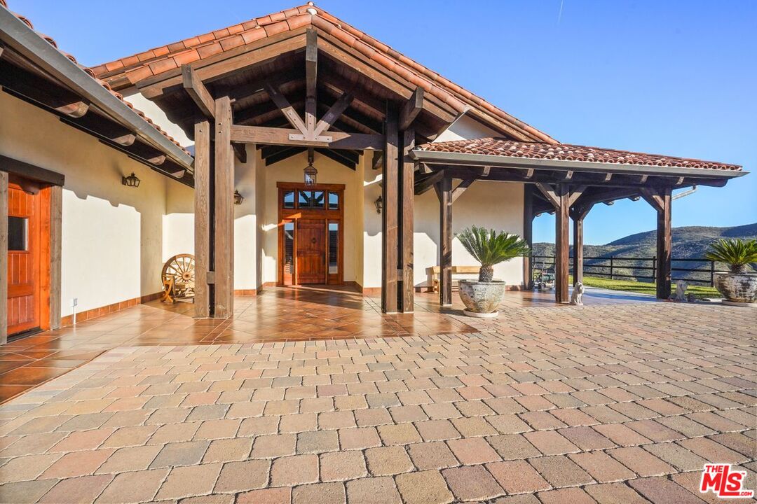 12486 Yerba Buena Road Malibu, CA 90265 - Photo 6 of 68 a view of a porch with a table and chairs
