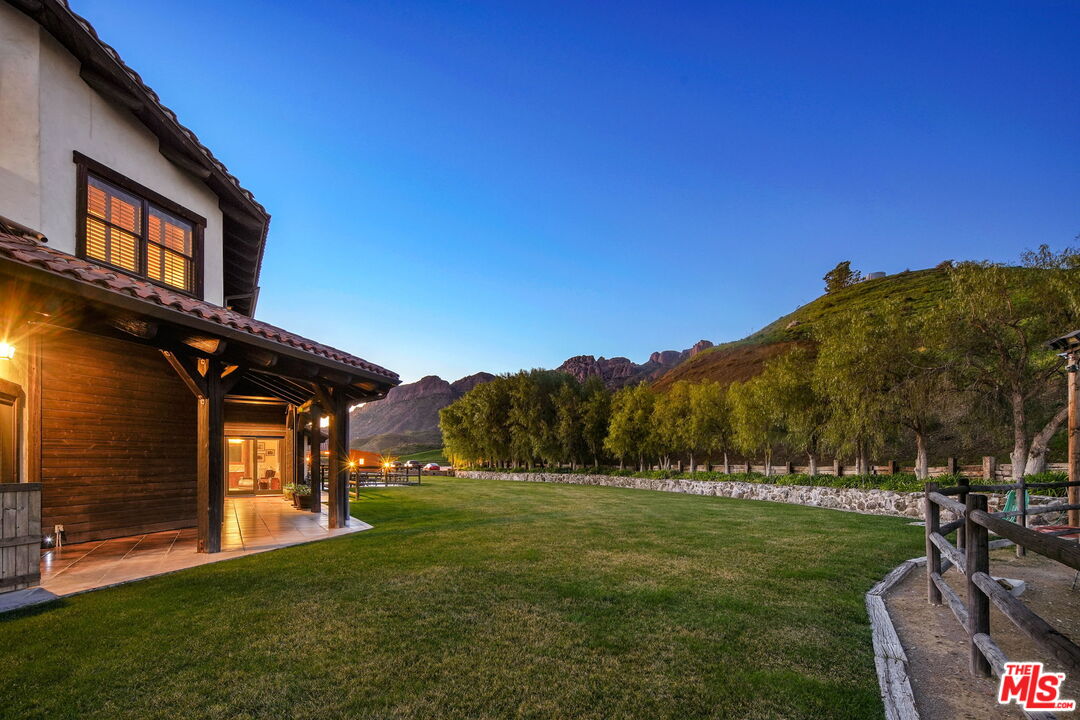 12486 Yerba Buena Road Malibu, CA 90265 - Photo 64 of 68 a view of a house with a backyard
