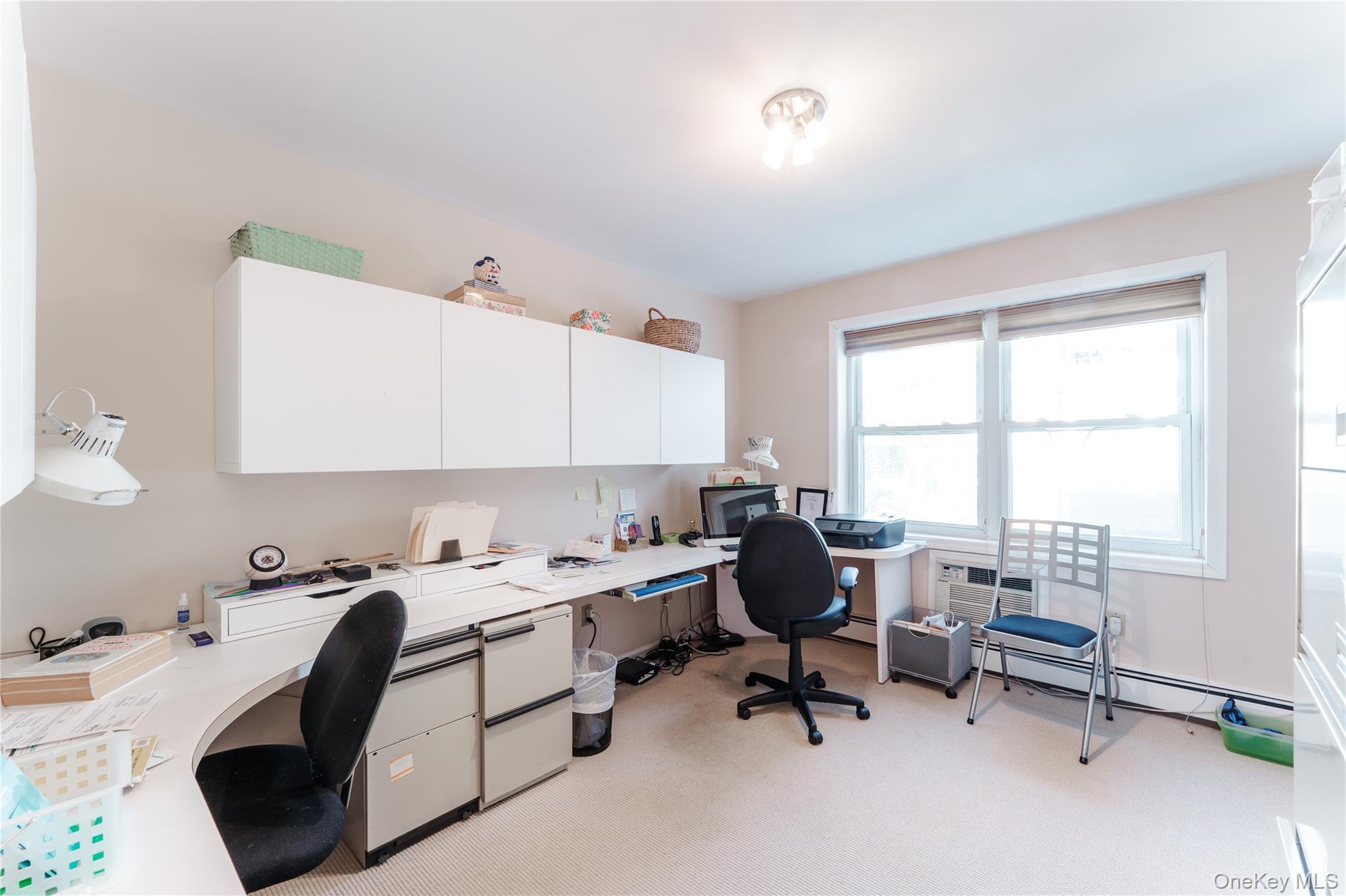 200 South Middle Neck Road, Unit F6 Great Neck, NY 11021 - Photo 11 of 16 a room that has a bed and a chair in it