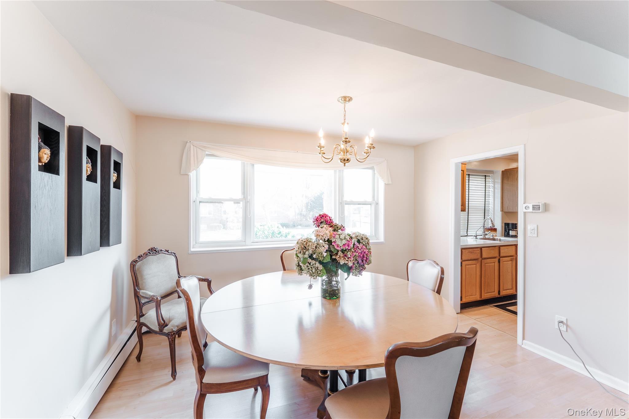 200 South Middle Neck Road, Unit F6 Great Neck, NY 11021 - Photo 4 of 16 a view of a dining room with furniture and window