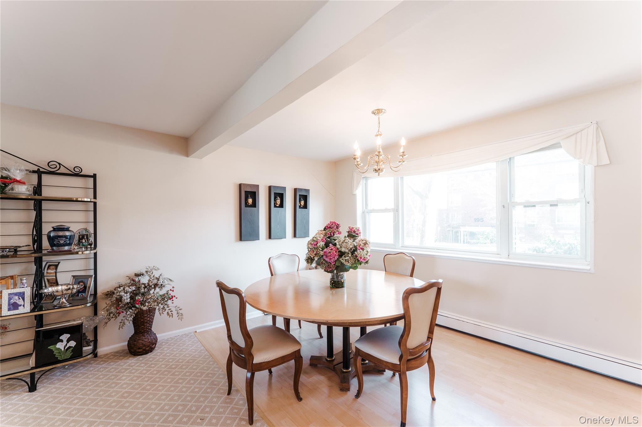 200 South Middle Neck Road, Unit F6 Great Neck, NY 11021 - Photo 5 of 16 a dining room with furniture and window