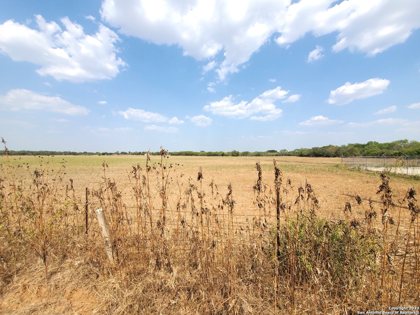 18996 Frank Hoffman Road Von Ormy, TX 78073 - Photo 12 of 13 a view of lake with houses in the back