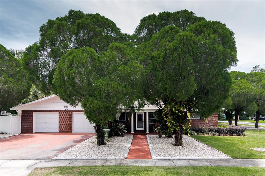 2434 Palmetto Road Mount Dora, FL 32757 - Photo 1 of 1 a front view of a house with yard