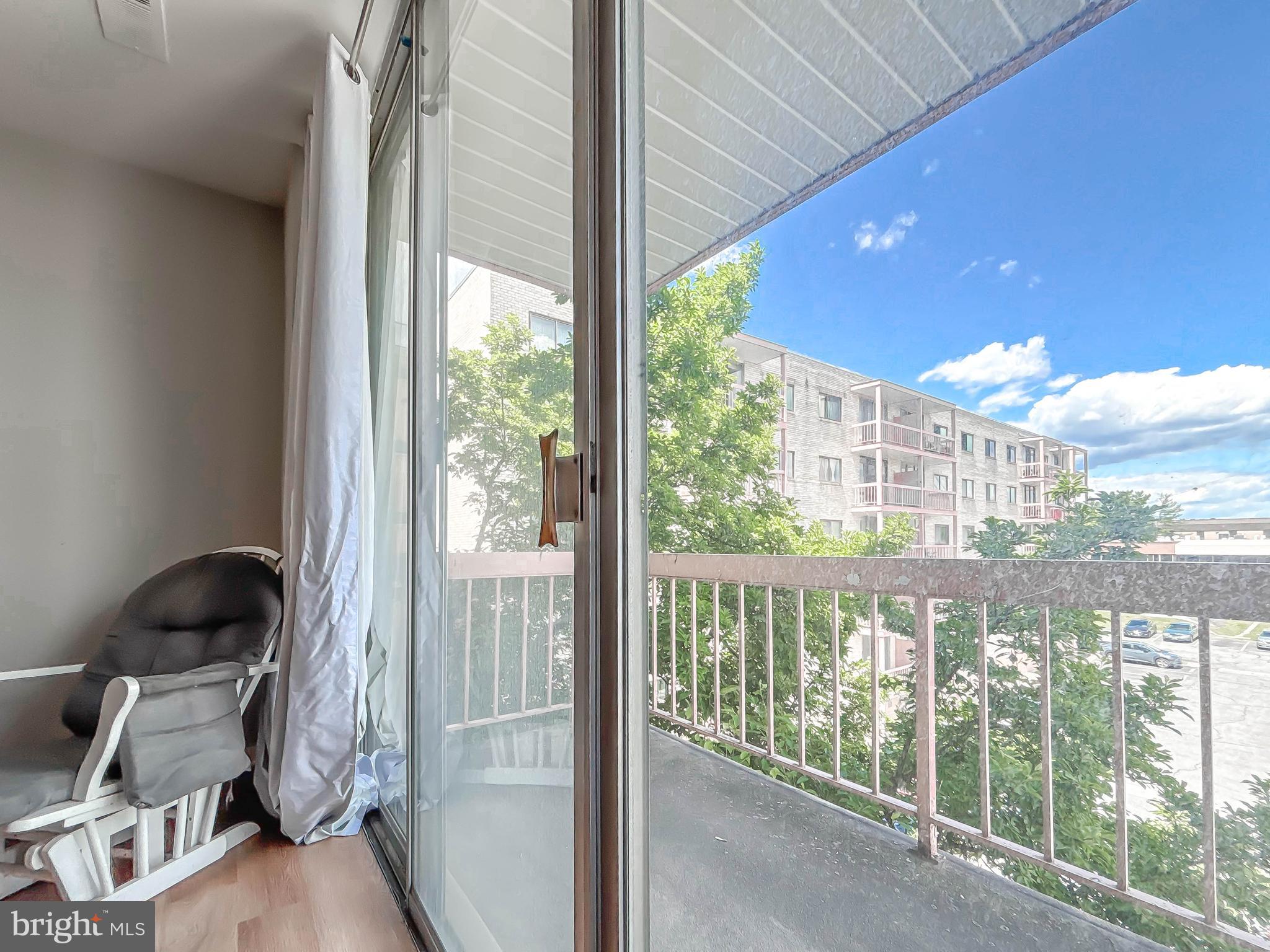 130 Slade Avenue, Unit 414 Baltimore, MD 21208 - Photo 11 of 48 a view of a room with a large window