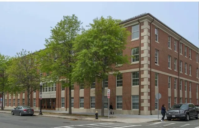 a front view of a building with street view