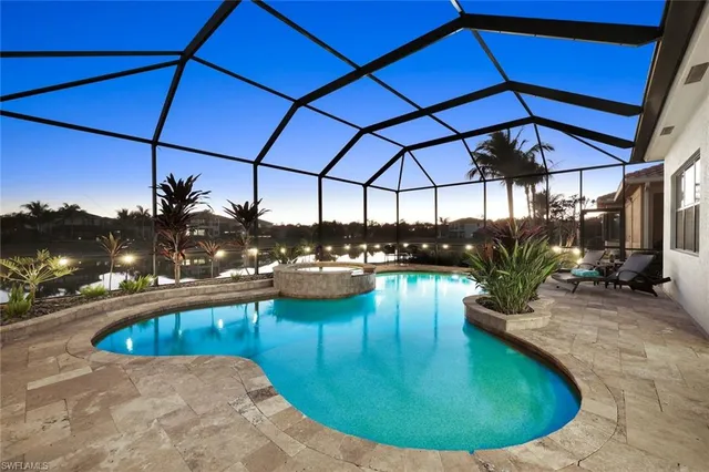 a view of a swimming pool with a patio