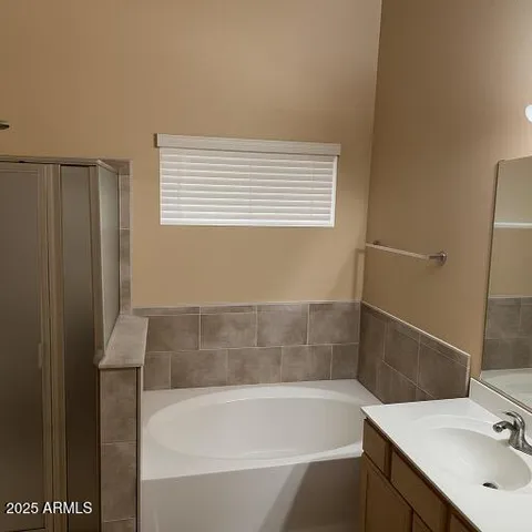 a bathroom with a bathtub and a sink