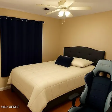 a bedroom with a bed and a closet