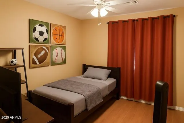 a bedroom with a bed and a window