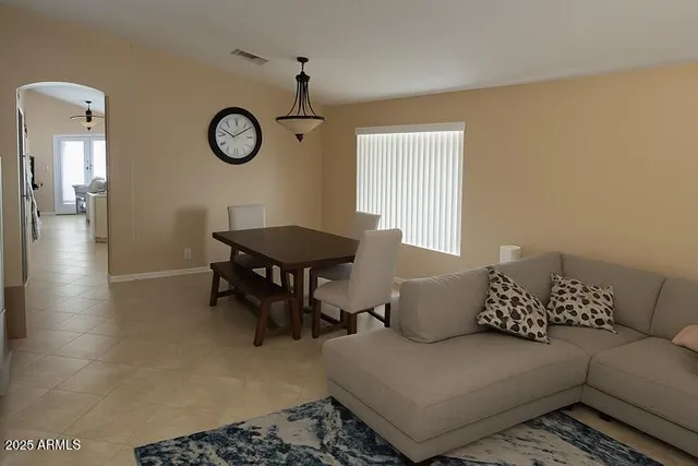 a living room with furniture and a window
