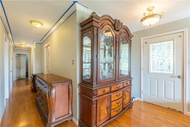 a room with lounge chair and windows