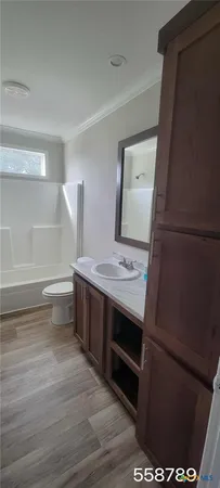 a view of cabinets and wooden floor