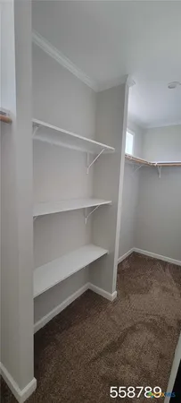 a view of an empty walk in closet