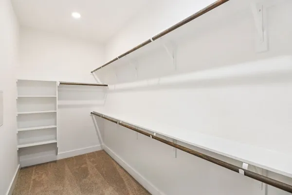 a view of an empty walk in closet