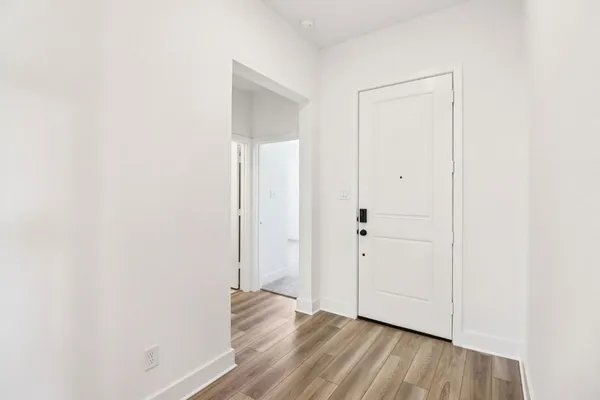 a view of a livingroom with wooden floor
