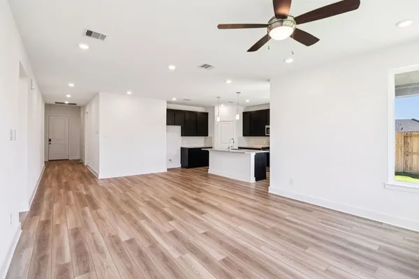 a view of a kitchen with microwave and a stove