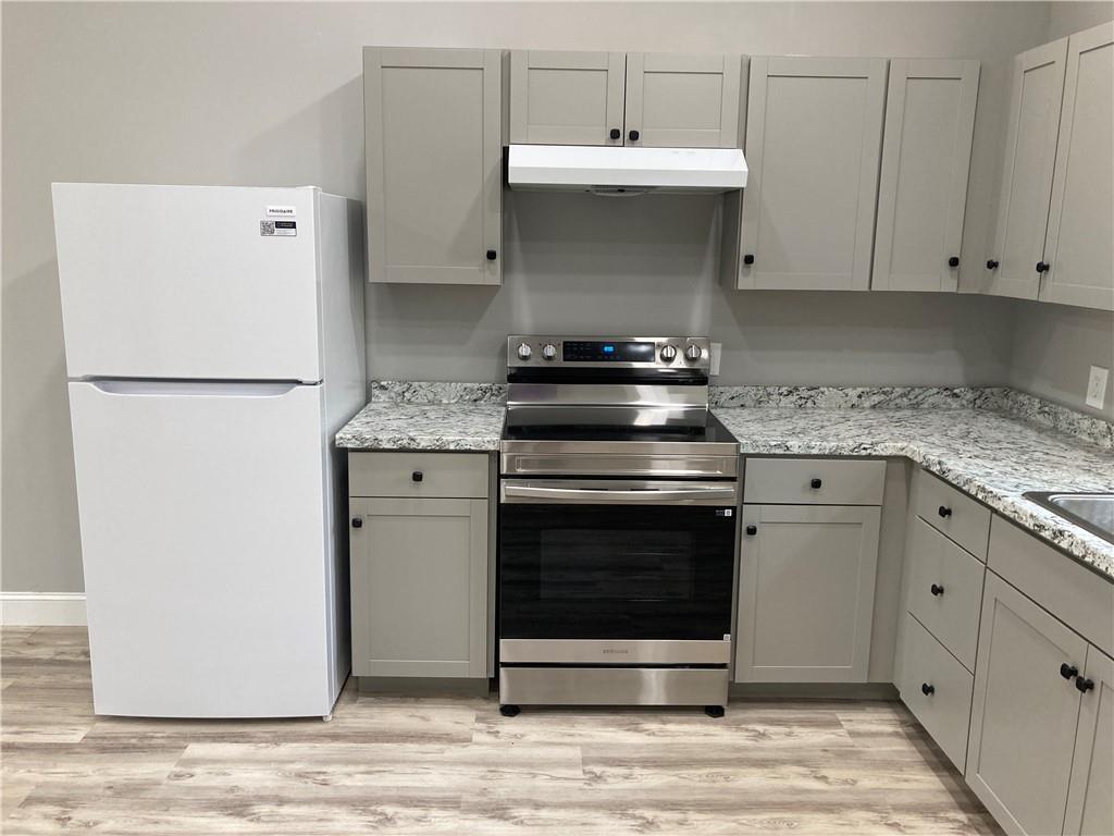 100 A Dickerson Road Dahlonega, GA 30533 - Photo 6 of 15 a kitchen with a stove and a white cabinet