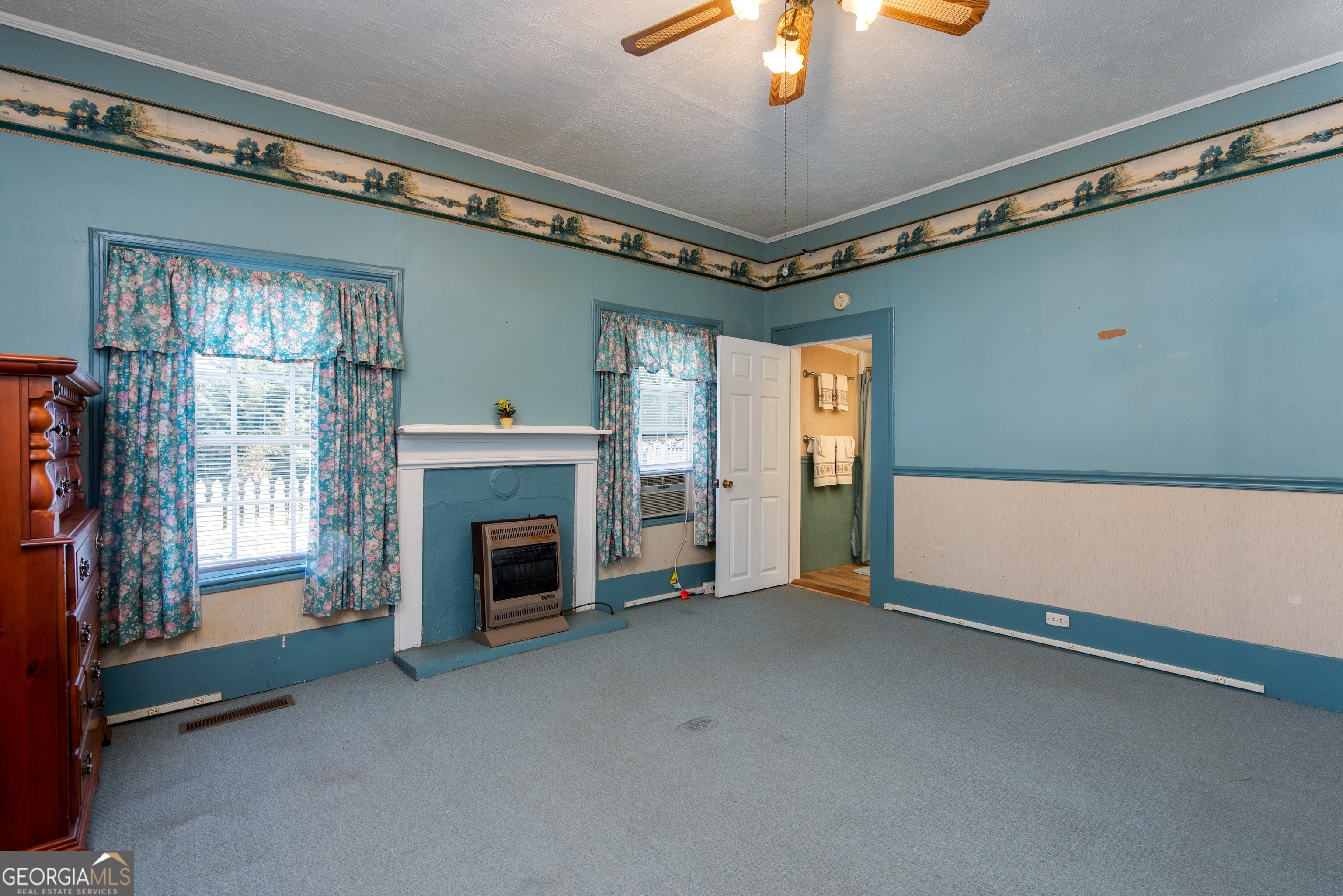 170 Fairplay Street Rutledge, GA 30663 - Photo 10 of 45 High ceilings and cozy fireplace with ensuite bath