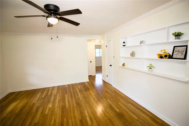 a view of storage and utility room with wooden floor