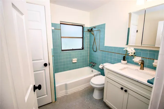 a bathroom with a sink a toilet and a bathtub