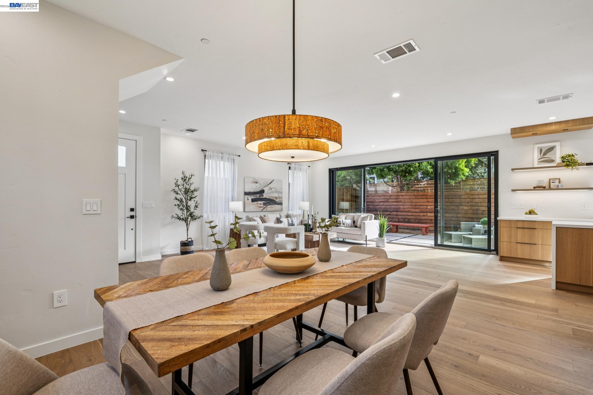 1142 Dwight Way Berkeley, CA 94702 - Photo 14 of 60 a view of a dining room with furniture wooden floor and chandelier