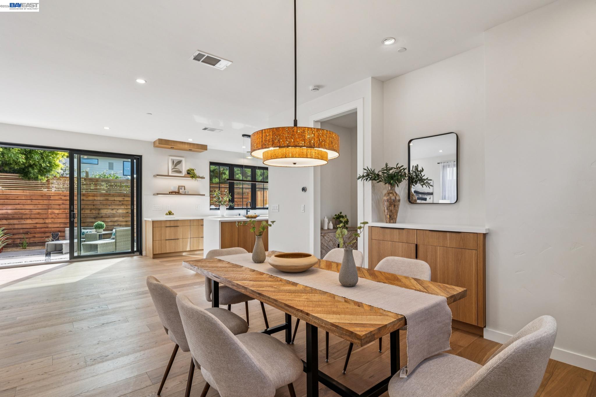 1142 Dwight Way Berkeley, CA 94702 - Photo 15 of 60 a dining room with furniture and wooden floor