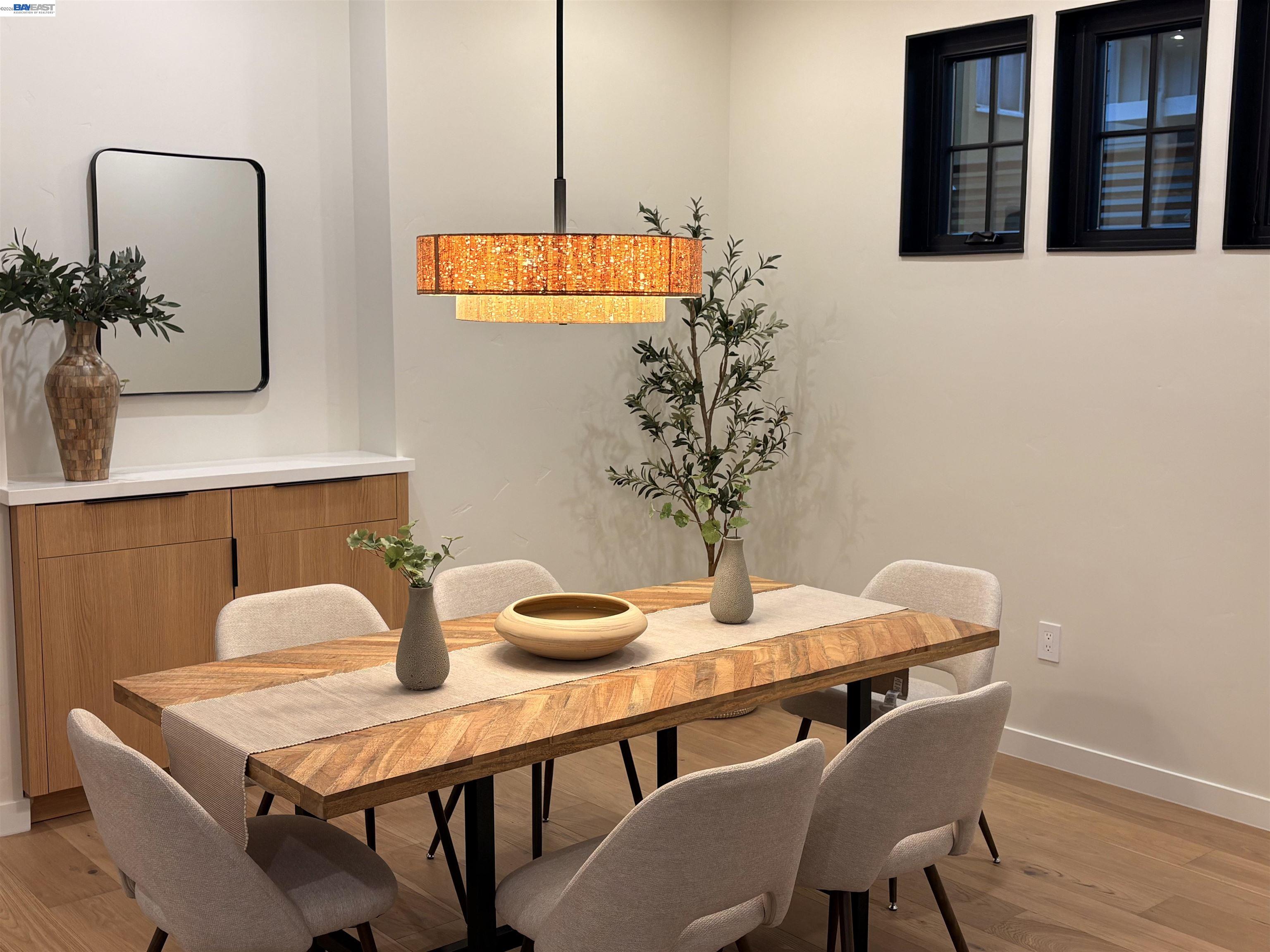 1142 Dwight Way Berkeley, CA 94702 - Photo 16 of 60 a dining room with furniture and wooden floor