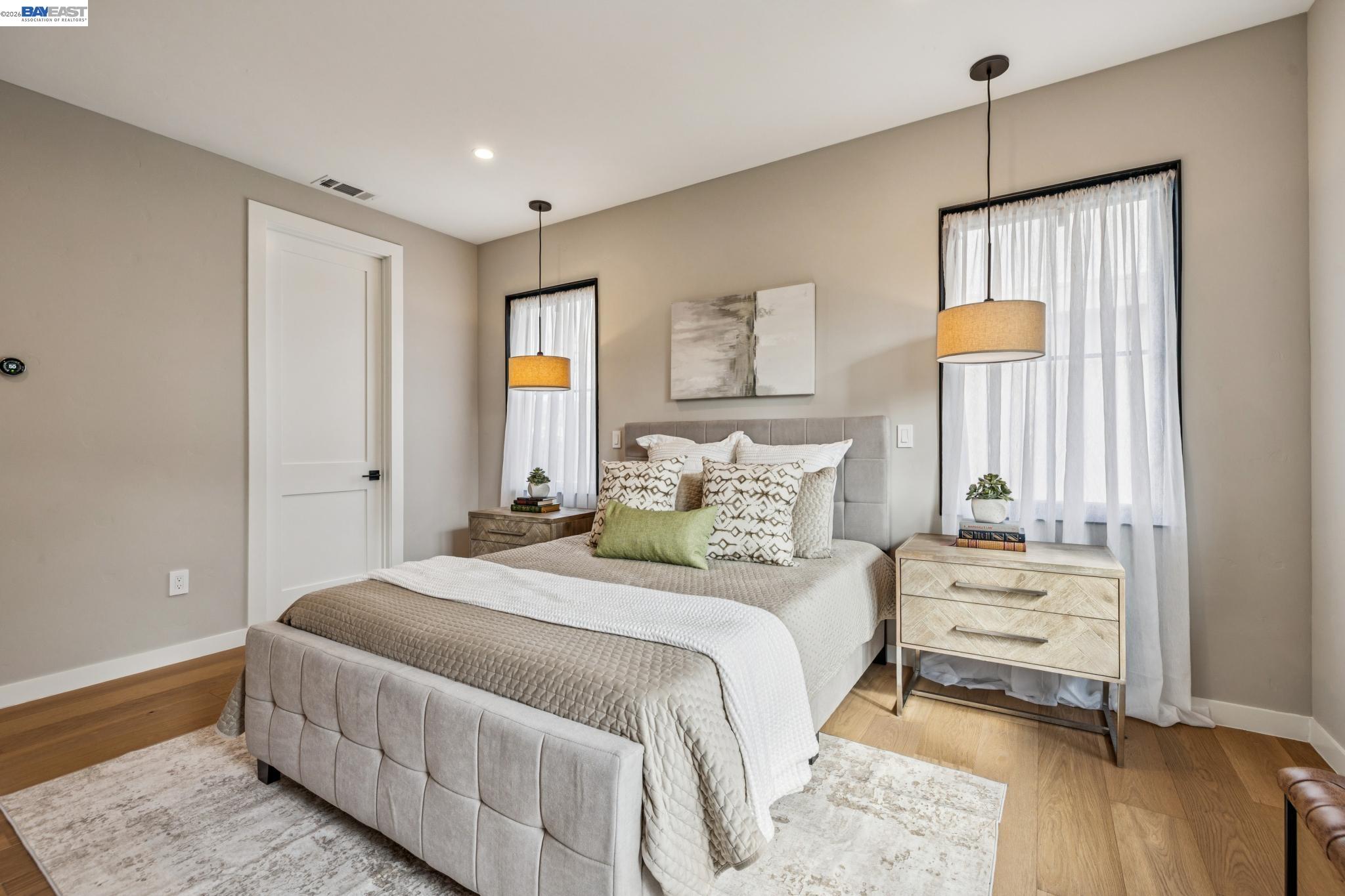 1142 Dwight Way Berkeley, CA 94702 - Photo 36 of 60 a bedroom with a bed a window and painting on the wall