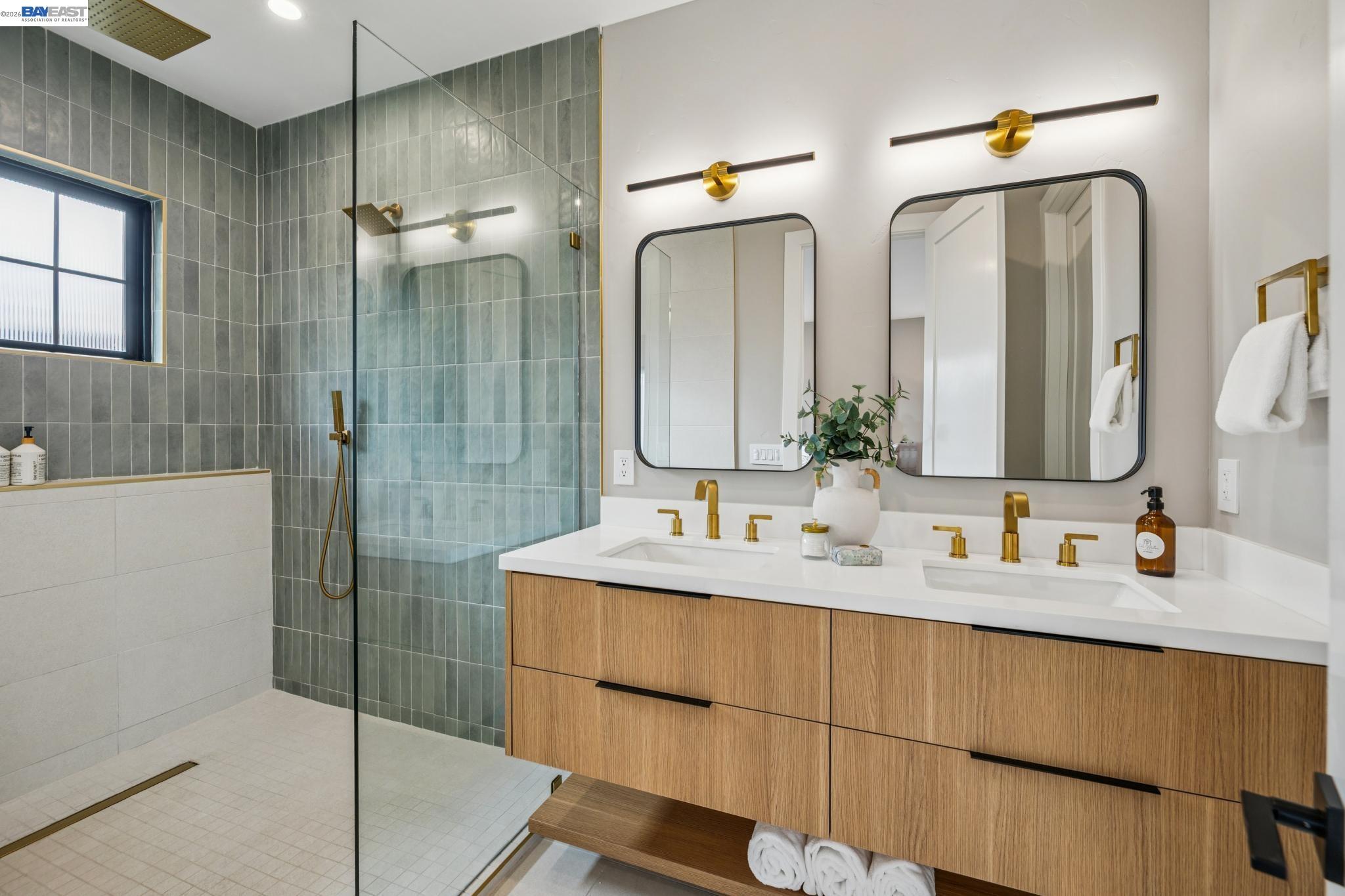 1142 Dwight Way Berkeley, CA 94702 - Photo 39 of 60 a bathroom with double vanity sinks double vanity tub and a mirror