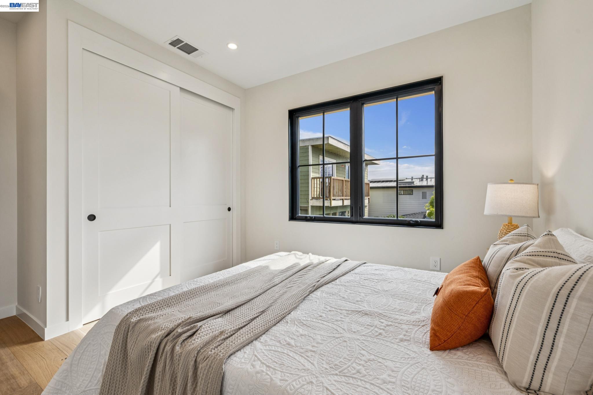 1142 Dwight Way Berkeley, CA 94702 - Photo 44 of 60 a bedroom with a bed and a window