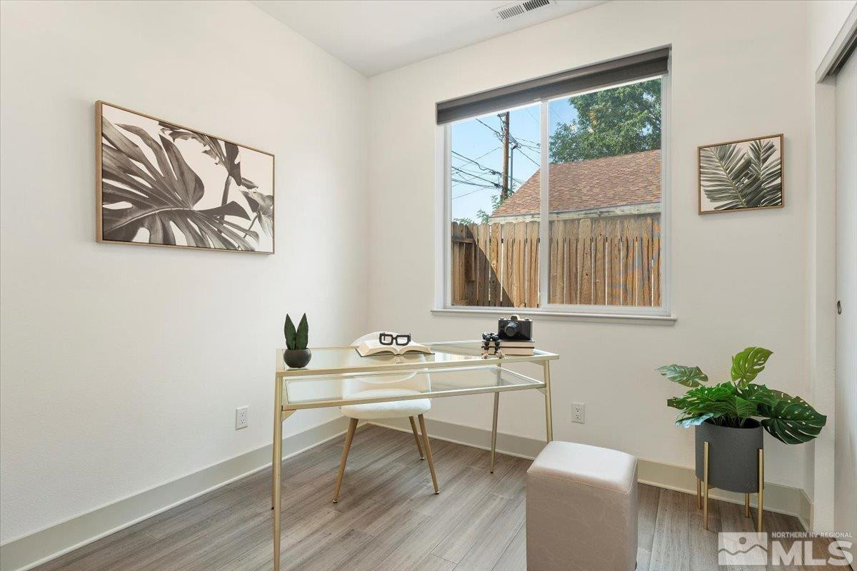 1219 Lander Street Reno, NV 89509 - Photo 13 of 18 a view of a workspace with furniture and a potted plant