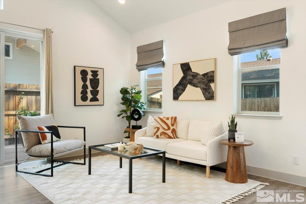 1219 Lander Street Reno, NV 89509 - Photo 5 of 18 a living room with furniture and a painting on the wall
