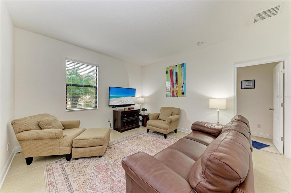 302 Cockle Shell Loop Apollo Beach, FL 33572 - Photo 44 of 75 a living room with furniture and a window
