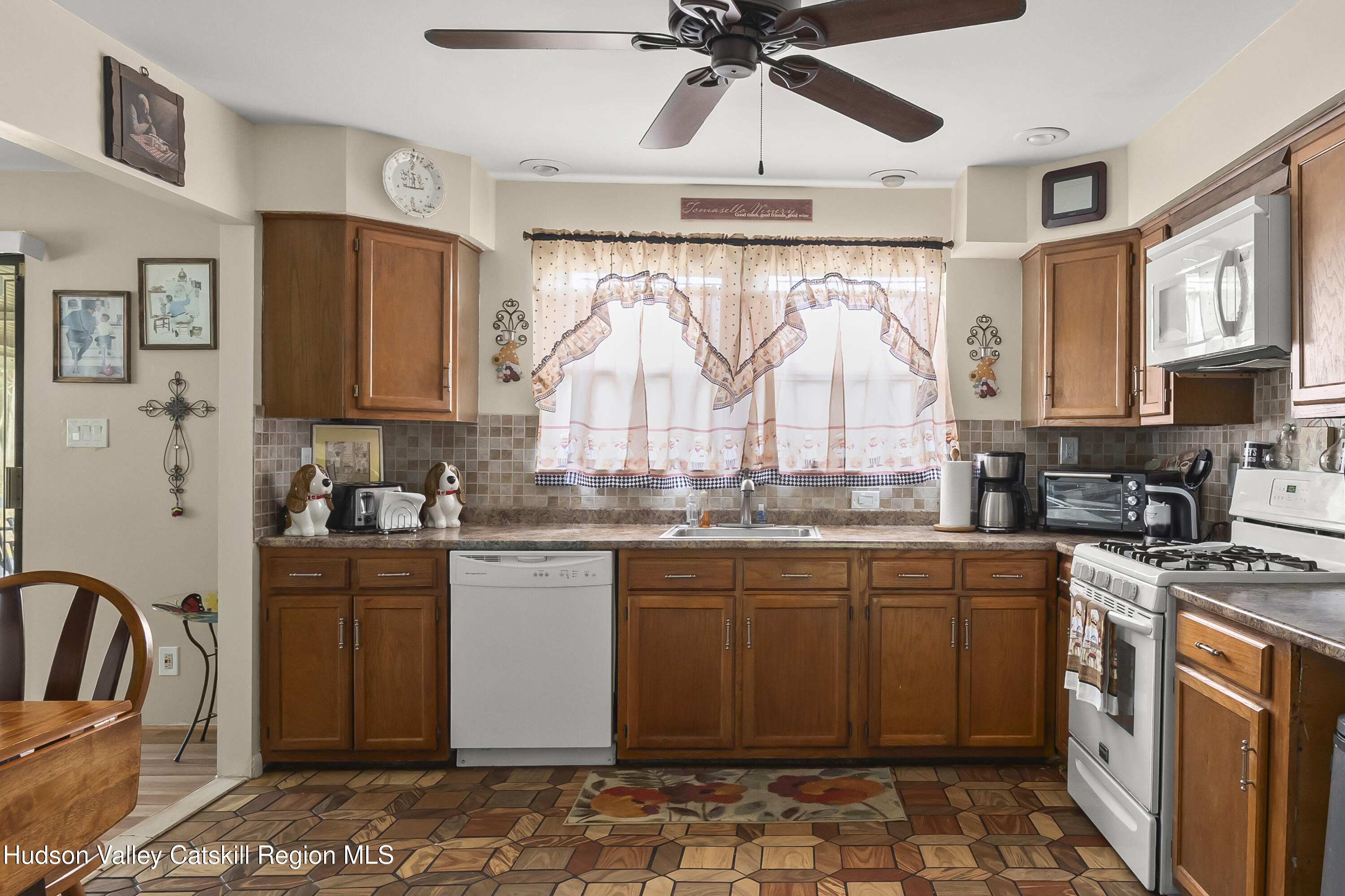 134 Willowbrook Road Hudson, NY 12534 - Photo 12 of 28 a kitchen with stainless steel appliances granite countertop a stove top oven a sink a counter space and cabinets