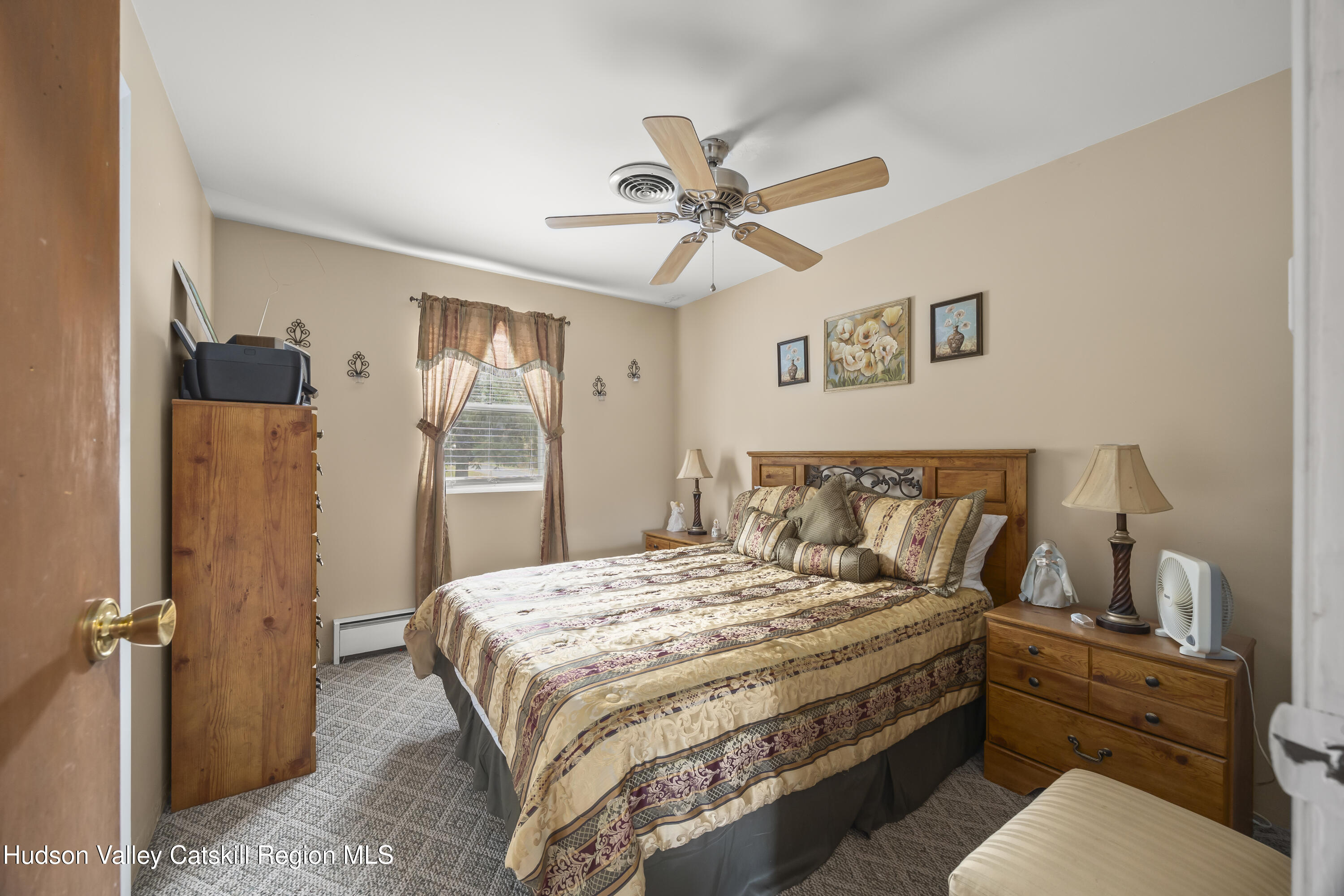 134 Willowbrook Road Hudson, NY 12534 - Photo 16 of 28 a bedroom with a large bed and a window