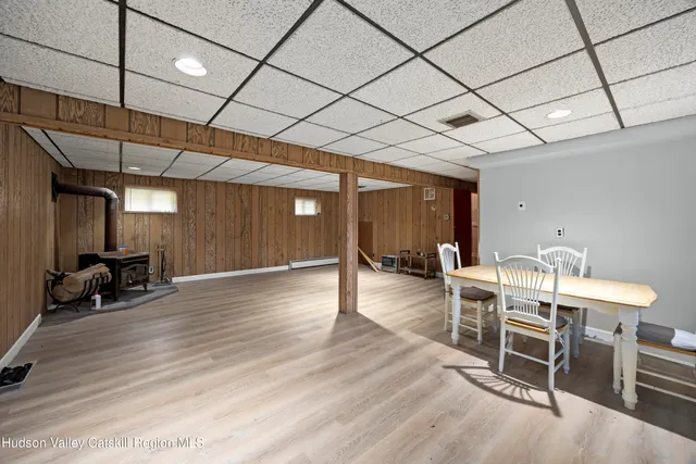a view of a room with furniture and wooden floor