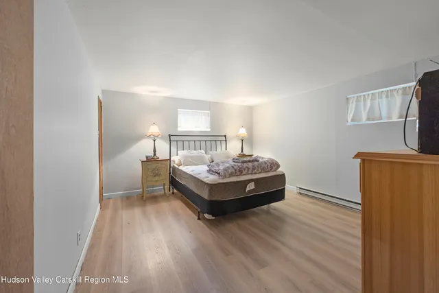 a room with a bed and a table in it