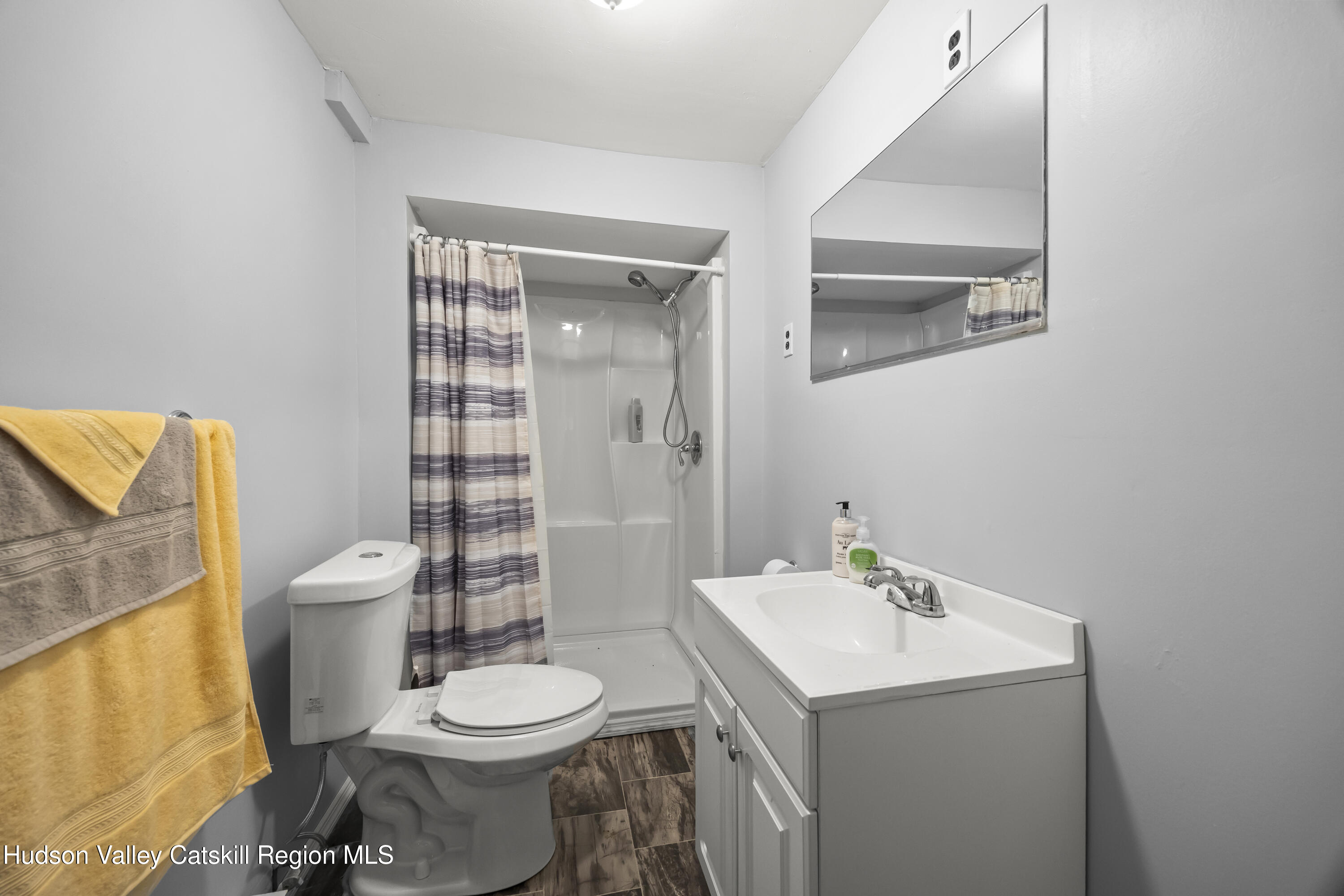 134 Willowbrook Road Hudson, NY 12534 - Photo 21 of 28 a bathroom with a toilet sink vanity and mirror