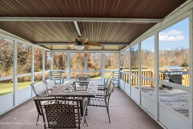 a view of a patio with a table chairs and a patio