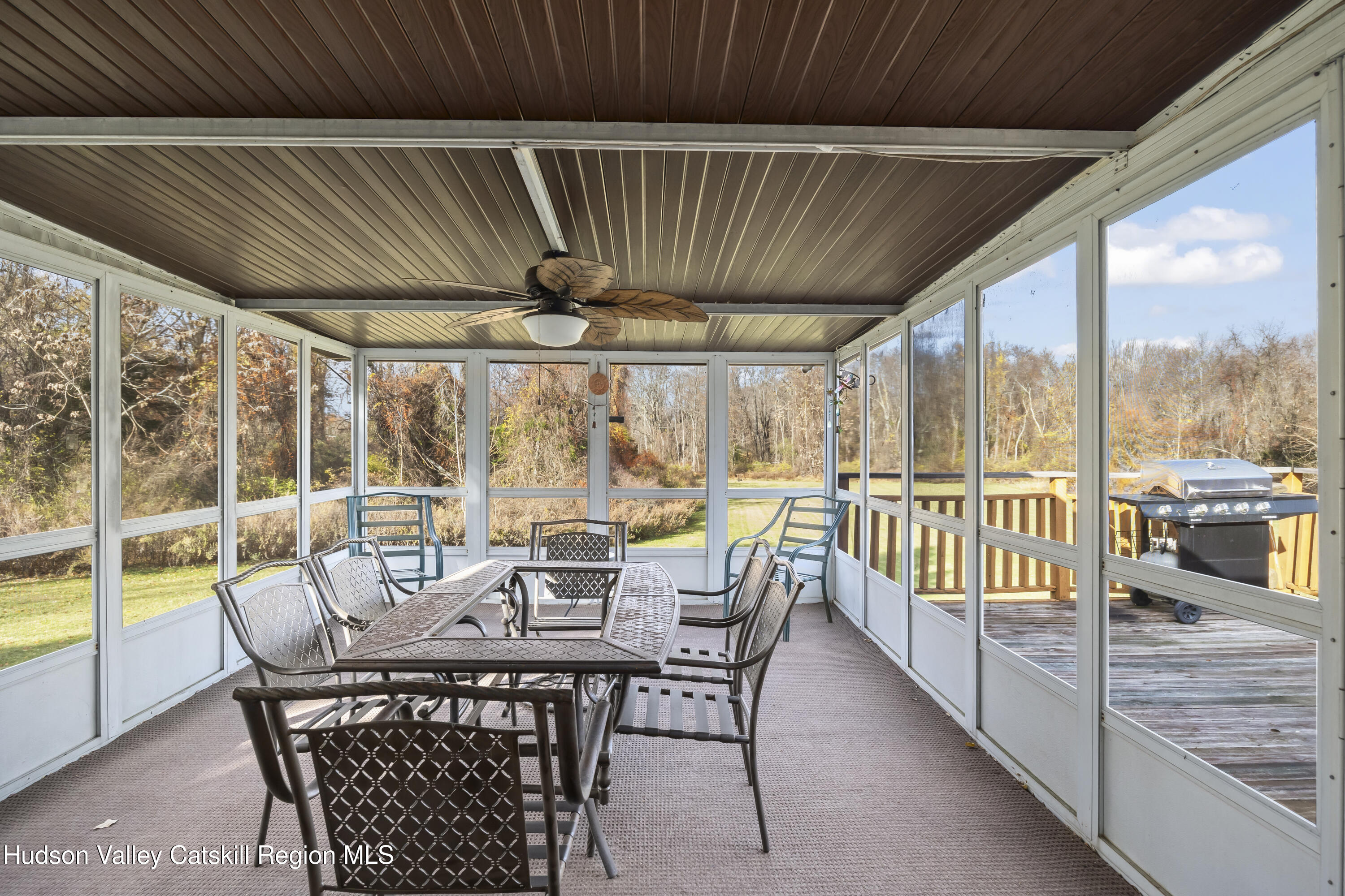 134 Willowbrook Road Hudson, NY 12534 - Photo 22 of 28 a view of a patio with a table chairs and a patio