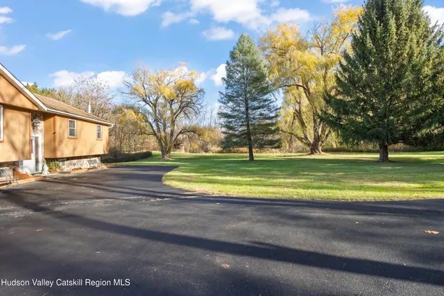 a view of a house with a big yard